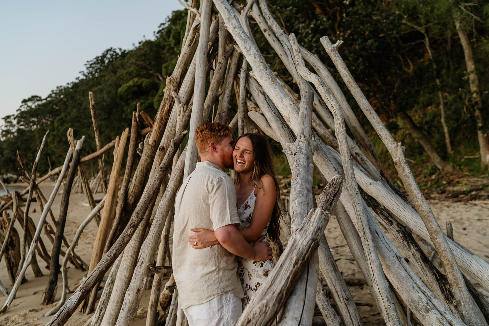 Couple laughing together at sunset during a Sydney couples photography session